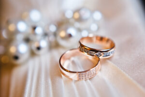 How A Prenup Can Benefit Your Marriage - gold wedding rings on the pincushion