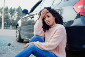 Post Car Accident Considerations - Black woman portrait after bad car accident