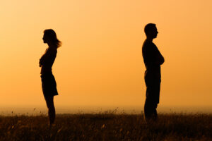 Living With A Narcissist & Marriage Complexities - couple back to back at sunset