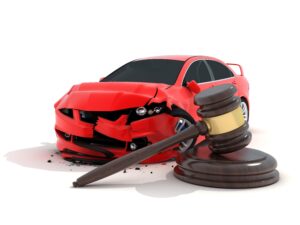 Dented red car next to judge's gavel